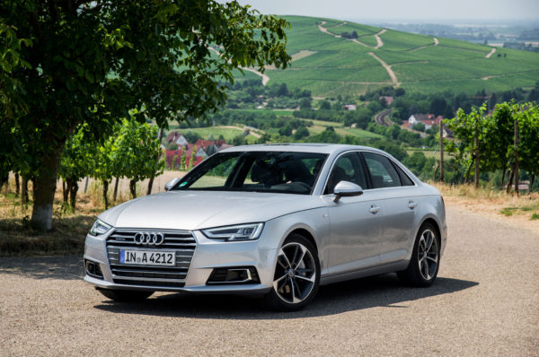 Silver 2017 Audi A4 with green hills