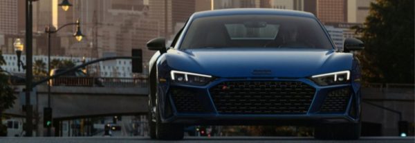 2020 Audi r8 driving down the road at dusk